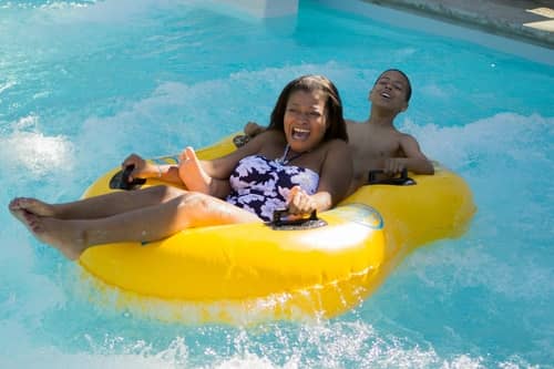 Mother and son float on raft at the Wave Waterpark