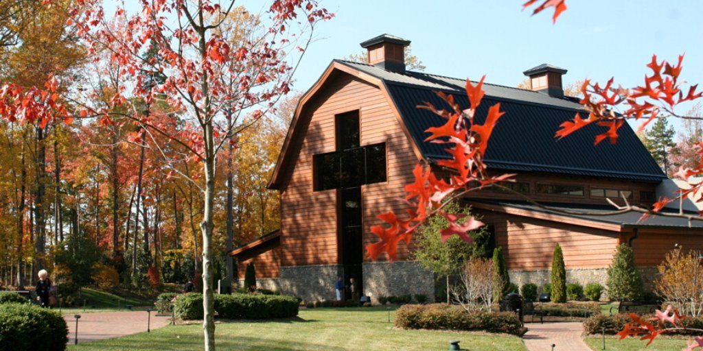 The Blily Graham Library with a cross window during autumn 