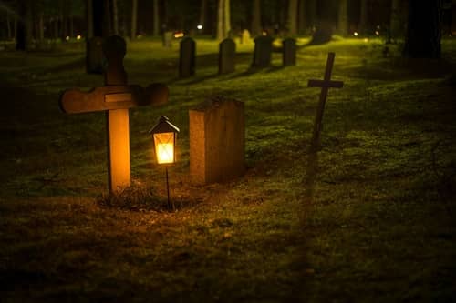 Image of a dimly lit graveyard at night