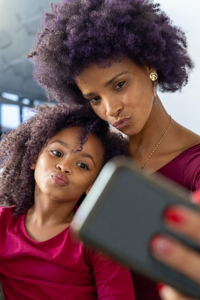 mother and daughter taking a selfie