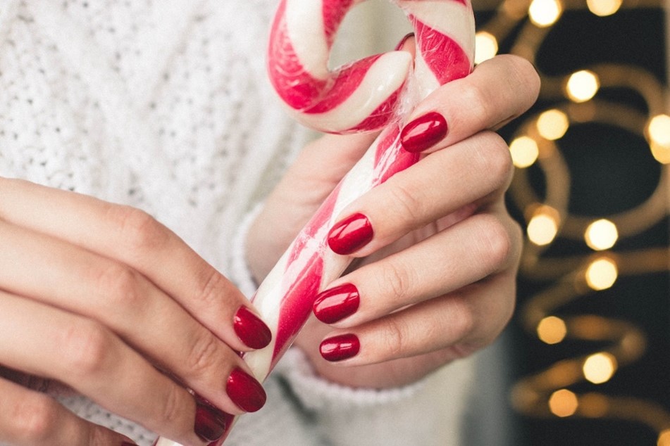 person holding candy cane
